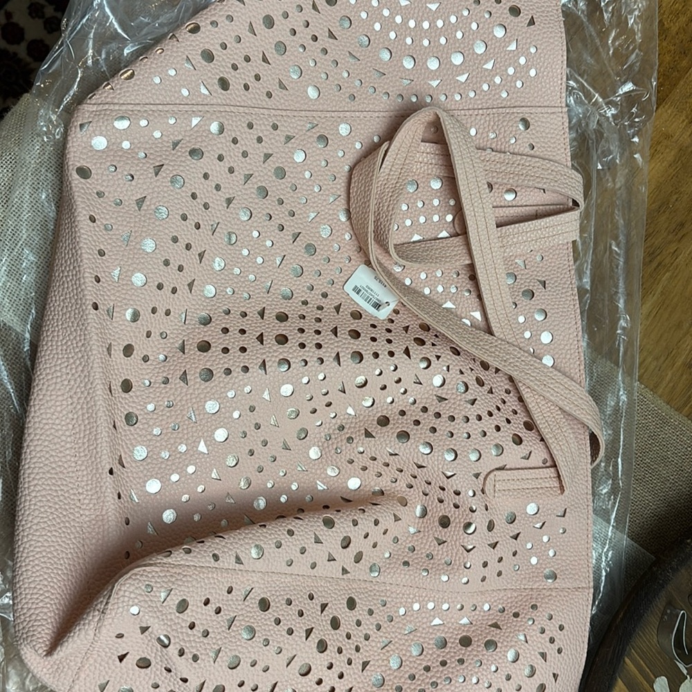 New, pink bag, tags still on bag.
